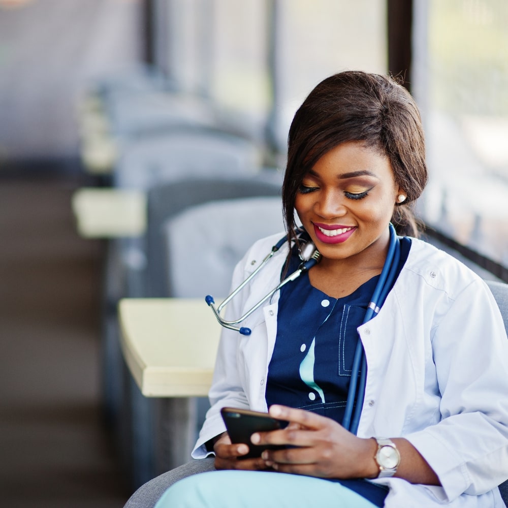 digital-culture-10 doctor looking at mobile device learning academies clinical education