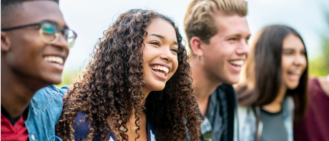 teenage-friends-laughing-outside-picture-id1037044238